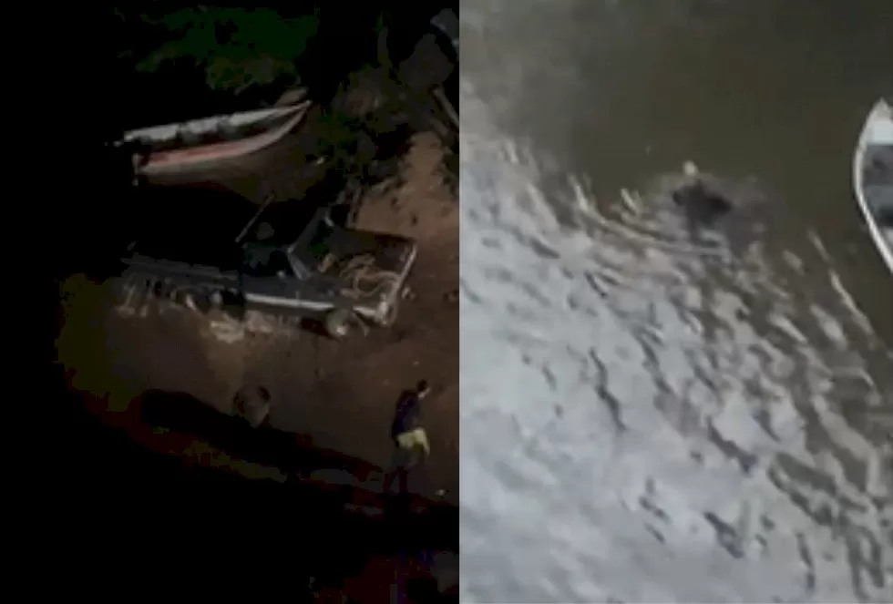 Caminhonete ficou submersa. (À direita, homem está no teto do veículo dentro do rio). — Foto: Paulo Moreno